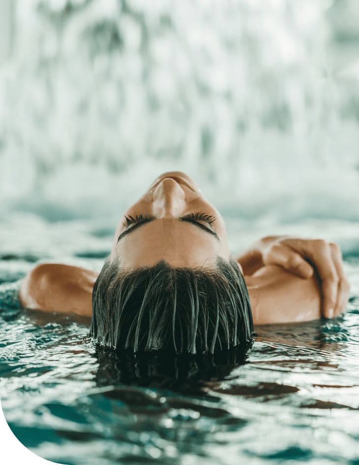 Artistic photo of woman getting out of the pool