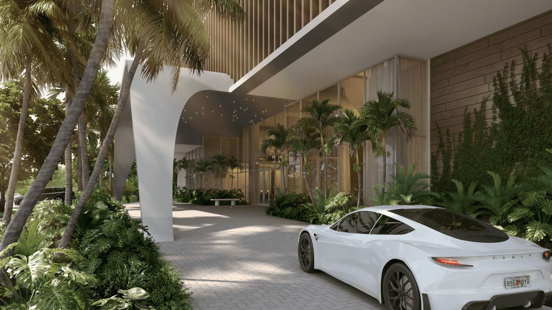 Entrance with lots of nature and sports car in front at Sage